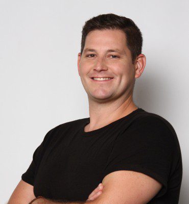 Aaron Peterson, Man wearing black shirt smiling, headshot