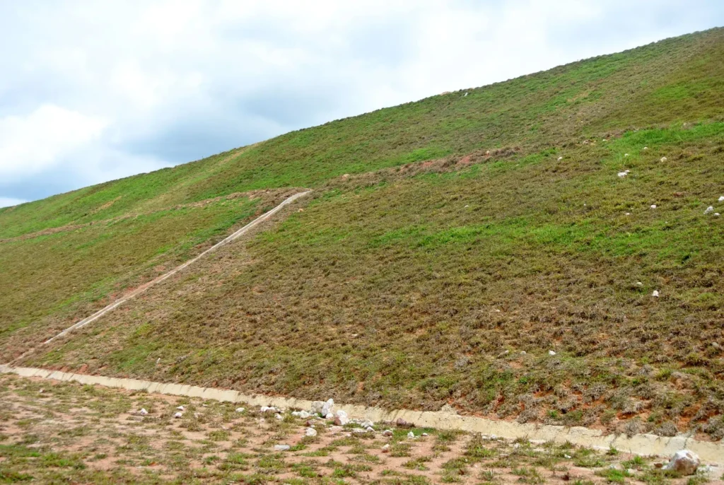 Current image: Hydroseeding being applied across a large rural acreage property in Alberta with open terrain and wide coverage