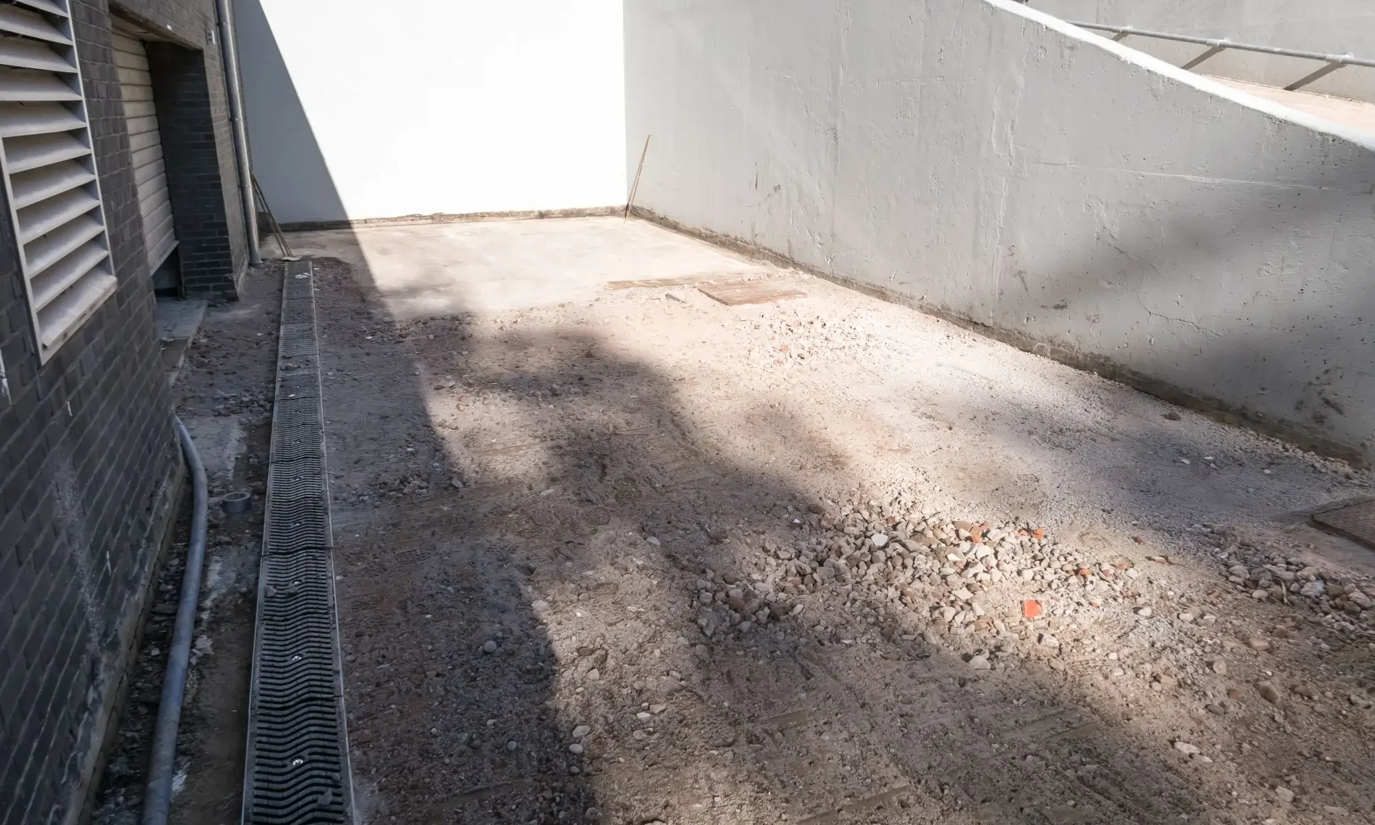 Bare soil on a newly constructed property in Edmonton before hydroseeding and erosion control treatment