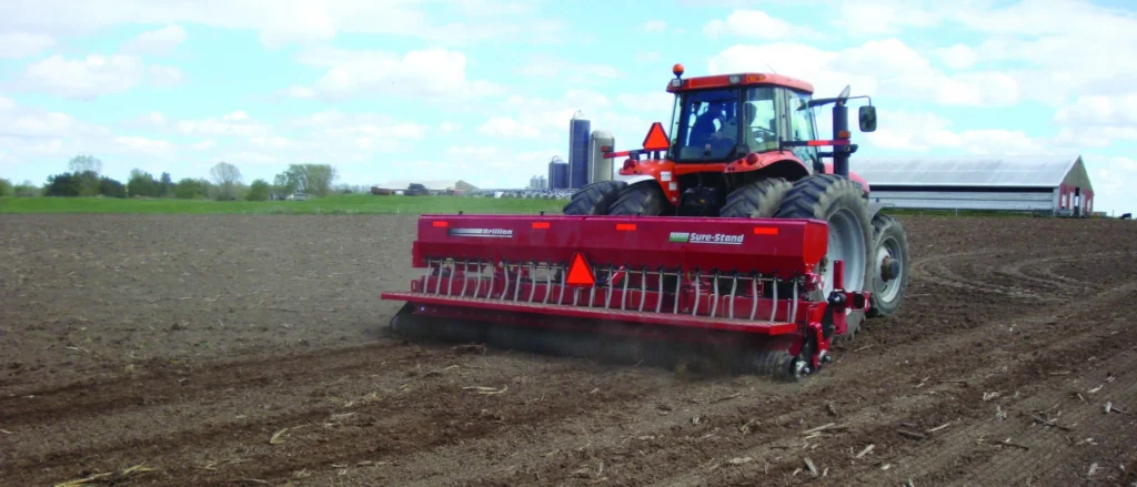 Drill seeding equipment working in large field